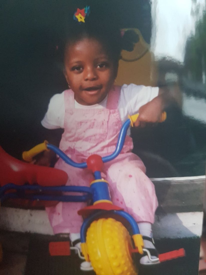 Baby Tayo on her tricycle